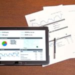 Ipad next to printed reports