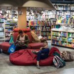 People on comfortable couches reading in a bookstore
